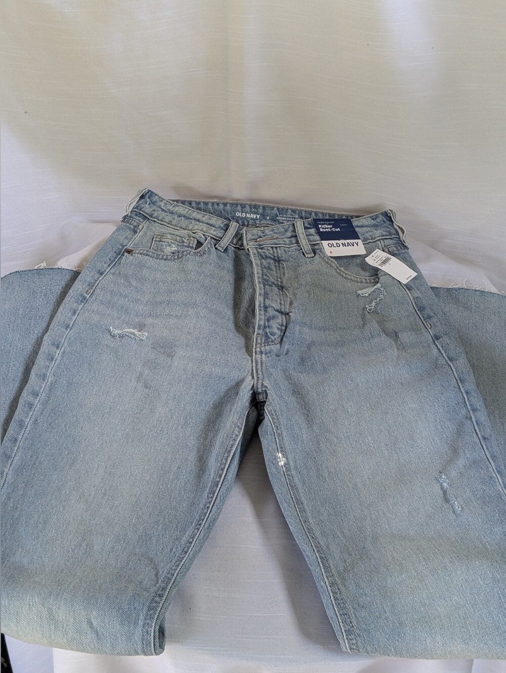 Old Navy Kicker Boot-Cut jeans featuring a light wash and distressed Sz 6